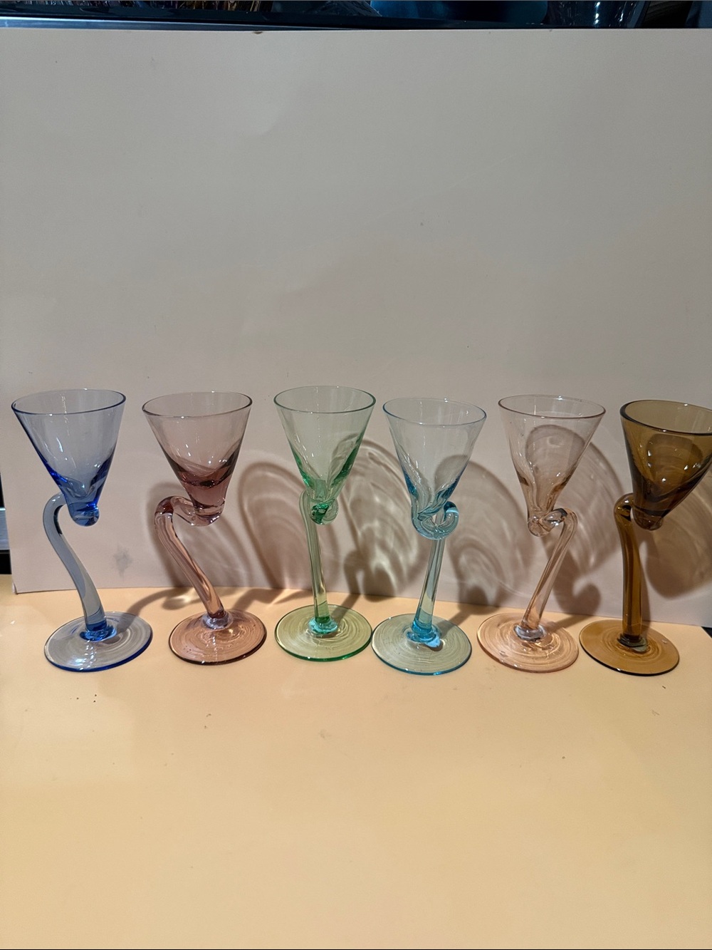 Vintage hand-blown harlequin cordial or sherry glasses featuring a twist.